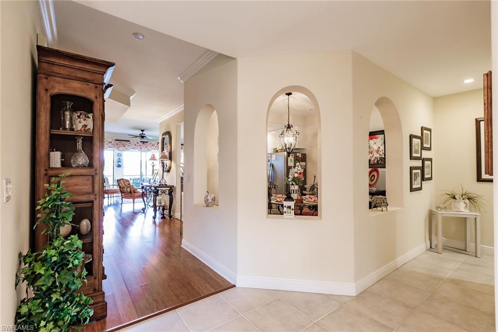 3910 Deer Crossing Court, Unit 1 Naples, FL 34114 - Photo 7 of 38 a view of a living room and dining room