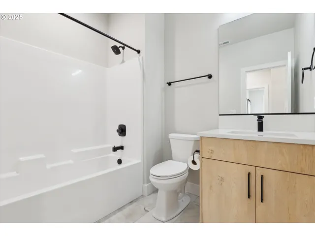 a bathroom with a sink a toilet and a bathtub