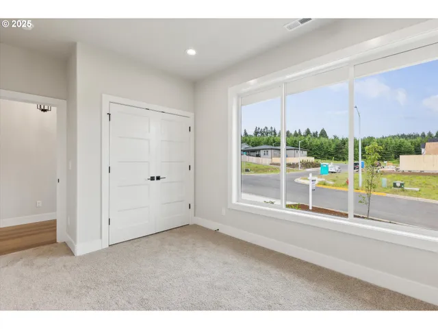 a view of an empty room with a sliding door