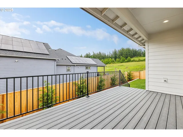 a view of balcony with wooden floor
