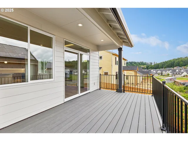 a view of balcony with wooden floor