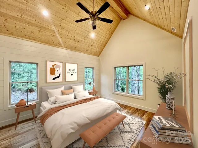 a bedroom with a large bed and a window