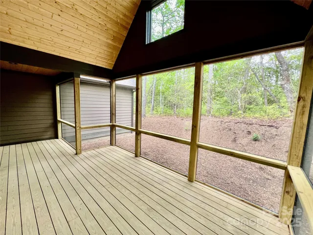 a view of outdoor space with wooden floor and city view