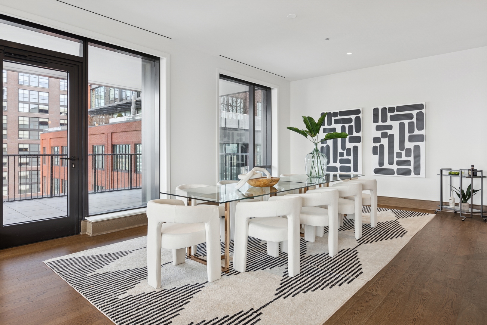 21 North May Street, Unit 703 Chicago, IL 60607 - Photo 26 of 56 a living room with furniture a rug and a table