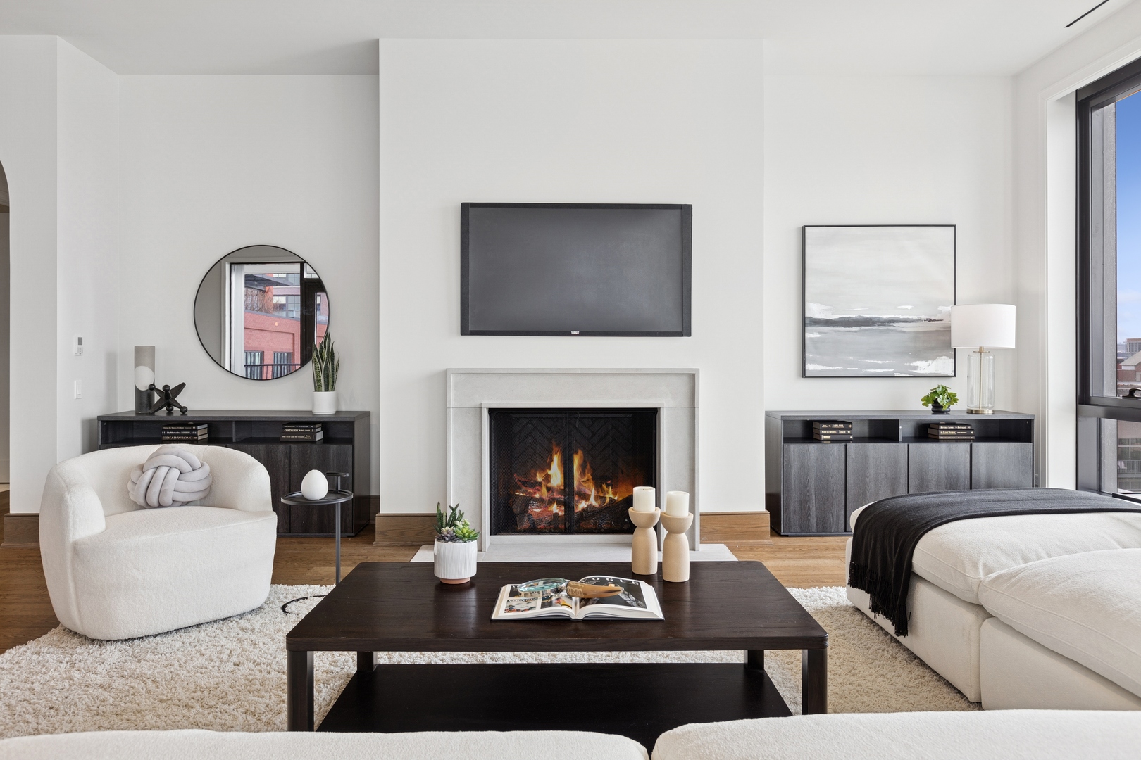 21 North May Street, Unit 703 Chicago, IL 60607 - Photo 9 of 56 a living room with furniture and a fireplace
