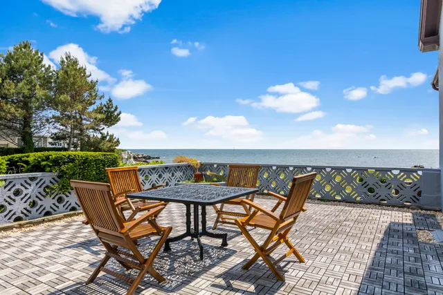 a view of a chairs and table on the terrace