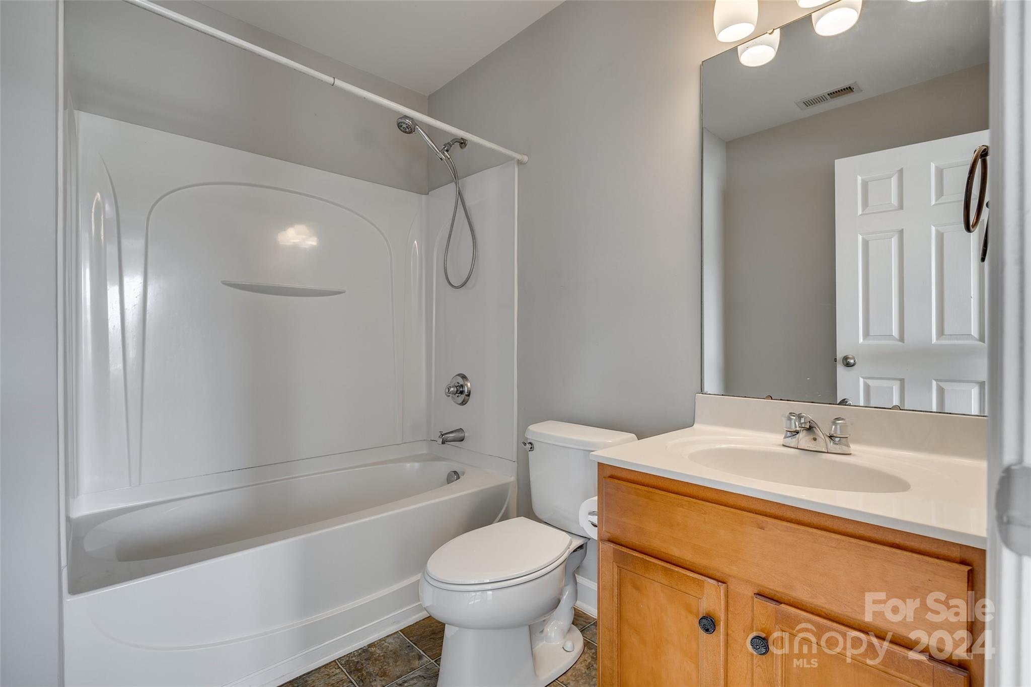 1446 Harpers Inlet Drive Clover, SC 29710 - Photo 16 of 28 a bathroom with a sink toilet and shower