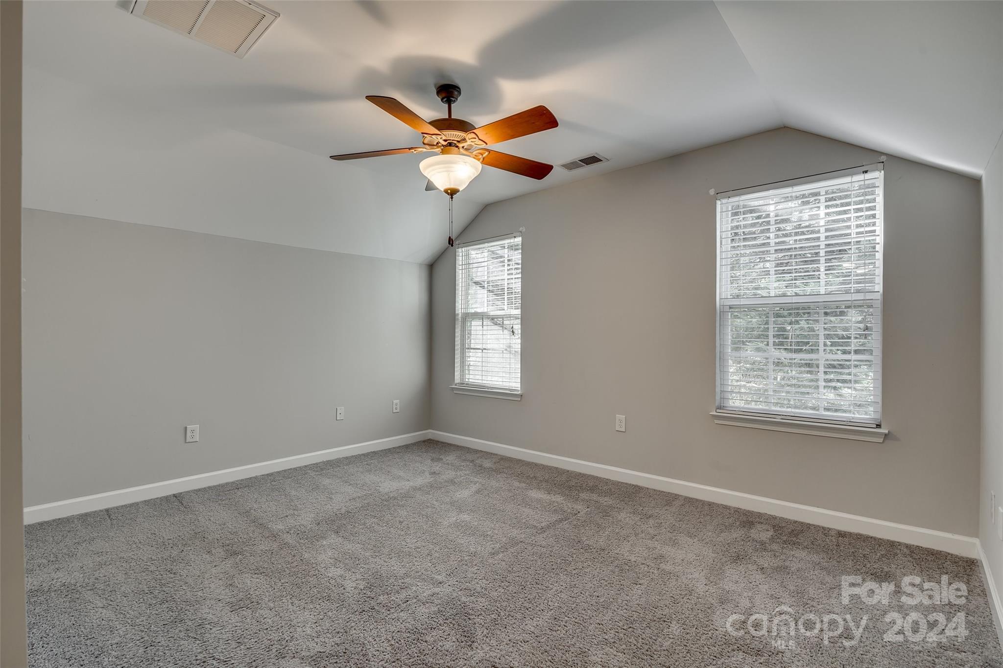 1446 Harpers Inlet Drive Clover, SC 29710 - Photo 20 of 28 a view of an empty room with window and chandelier fan