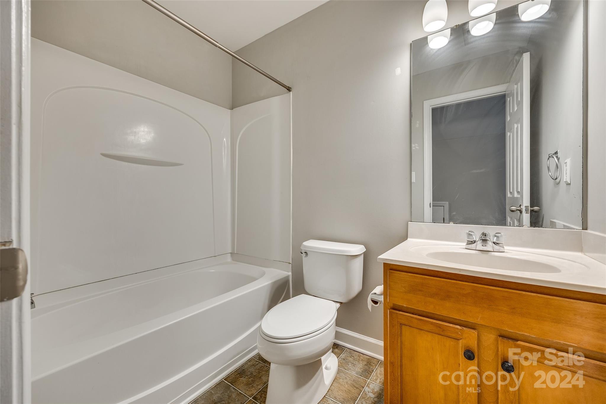 1446 Harpers Inlet Drive Clover, SC 29710 - Photo 24 of 28 a bathroom with a sink toilet and shower