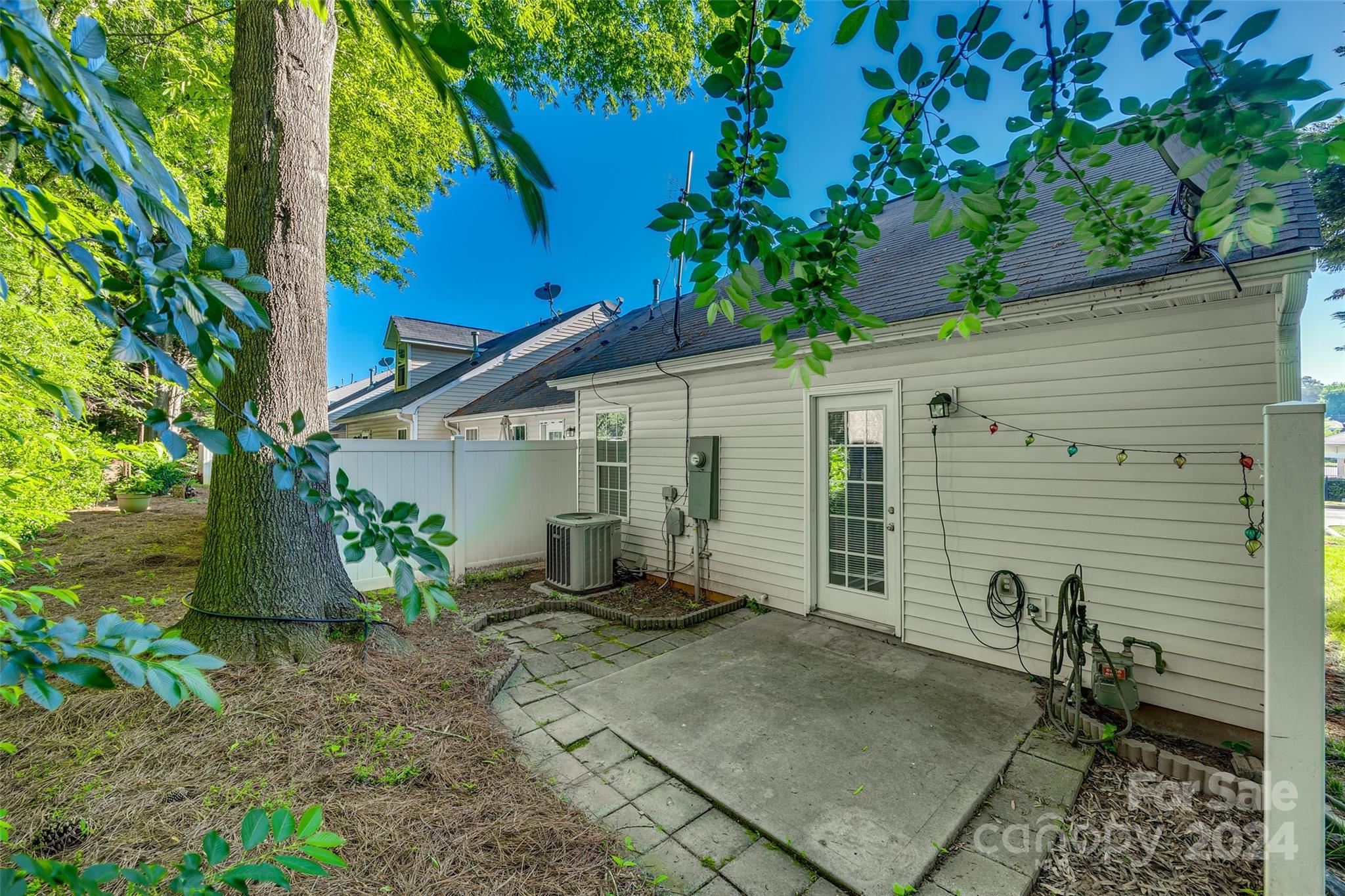 1446 Harpers Inlet Drive Clover, SC 29710 - Photo 25 of 28 a backyard of a house with plants and trees