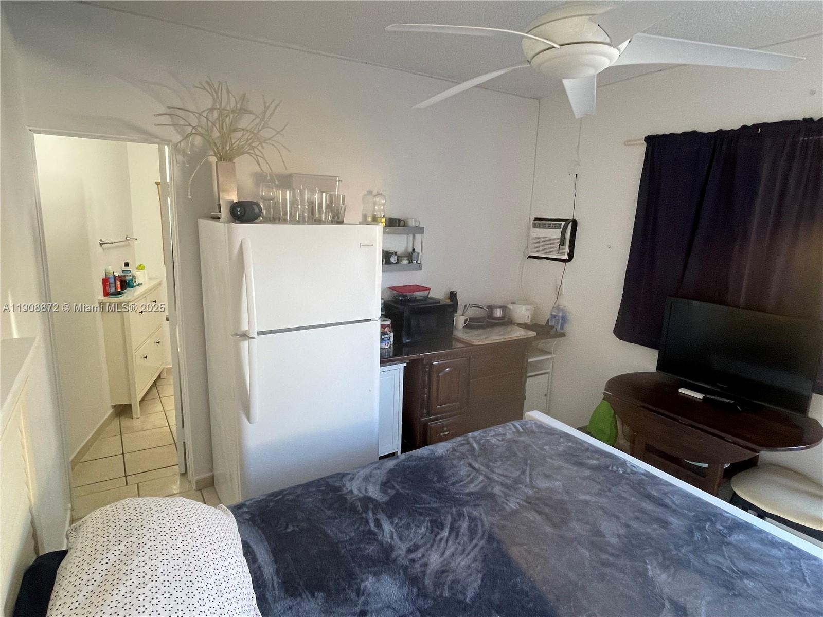 1832 Southwest 3rd Street Miami, FL 33135 - Photo 11 of 25 a bedroom with a bed and a dresser