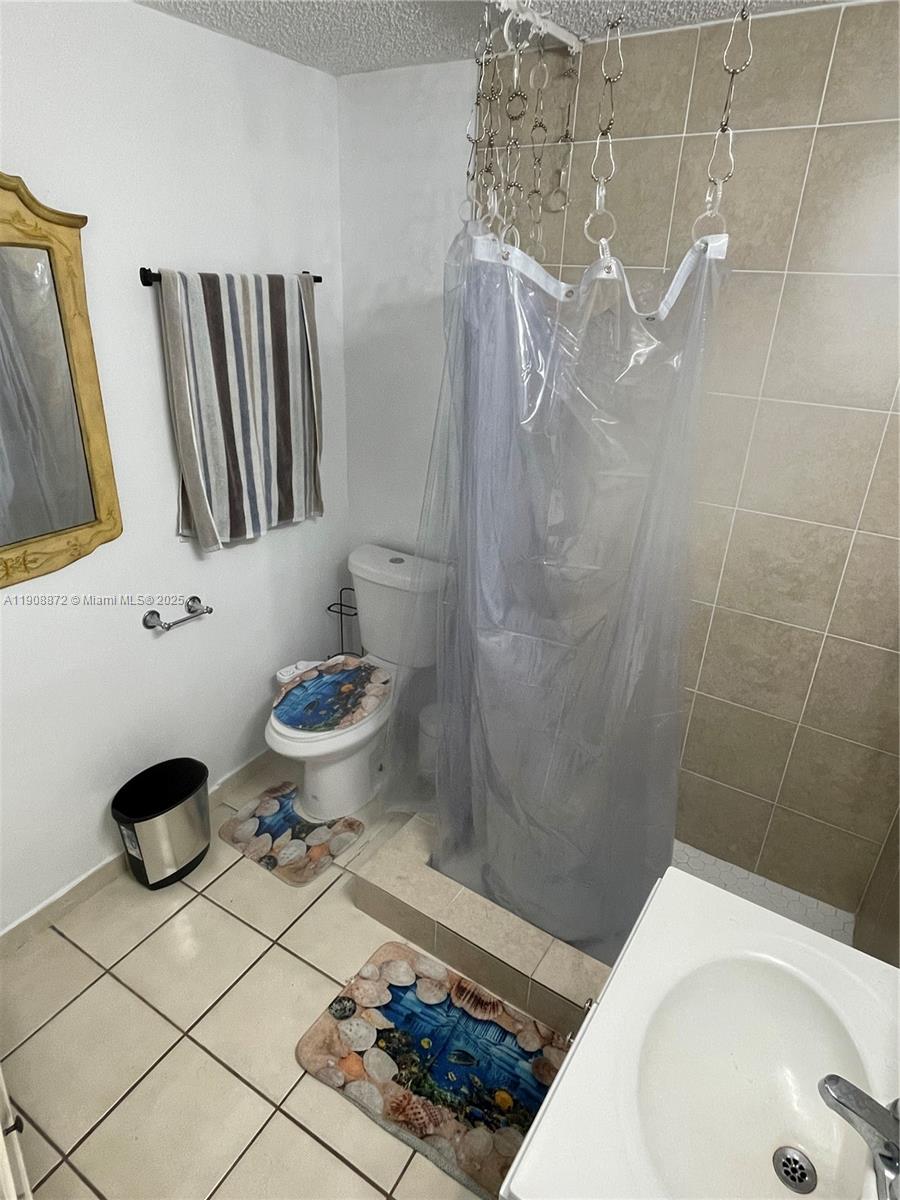 1832 Southwest 3rd Street Miami, FL 33135 - Photo 12 of 25 a bathroom with a sink toilet and shower