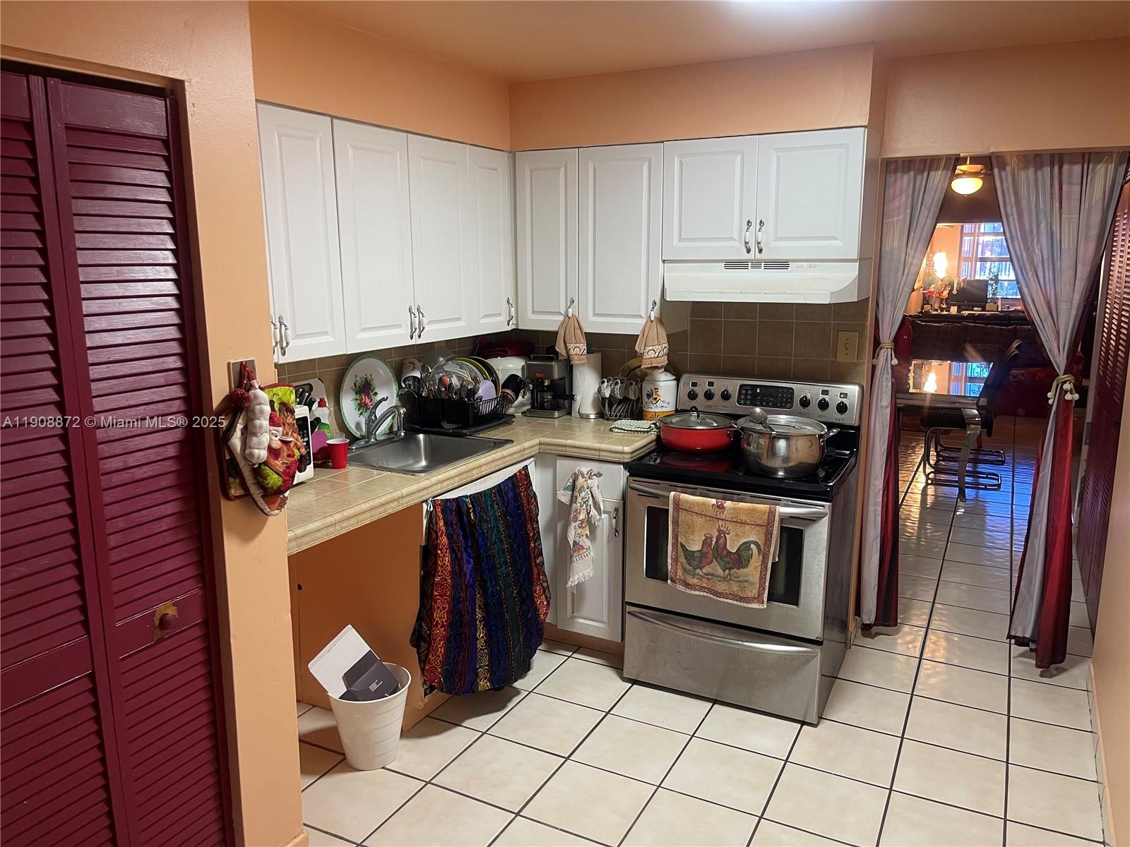 1832 Southwest 3rd Street Miami, FL 33135 - Photo 17 of 25 a kitchen with a stove and a refrigerator