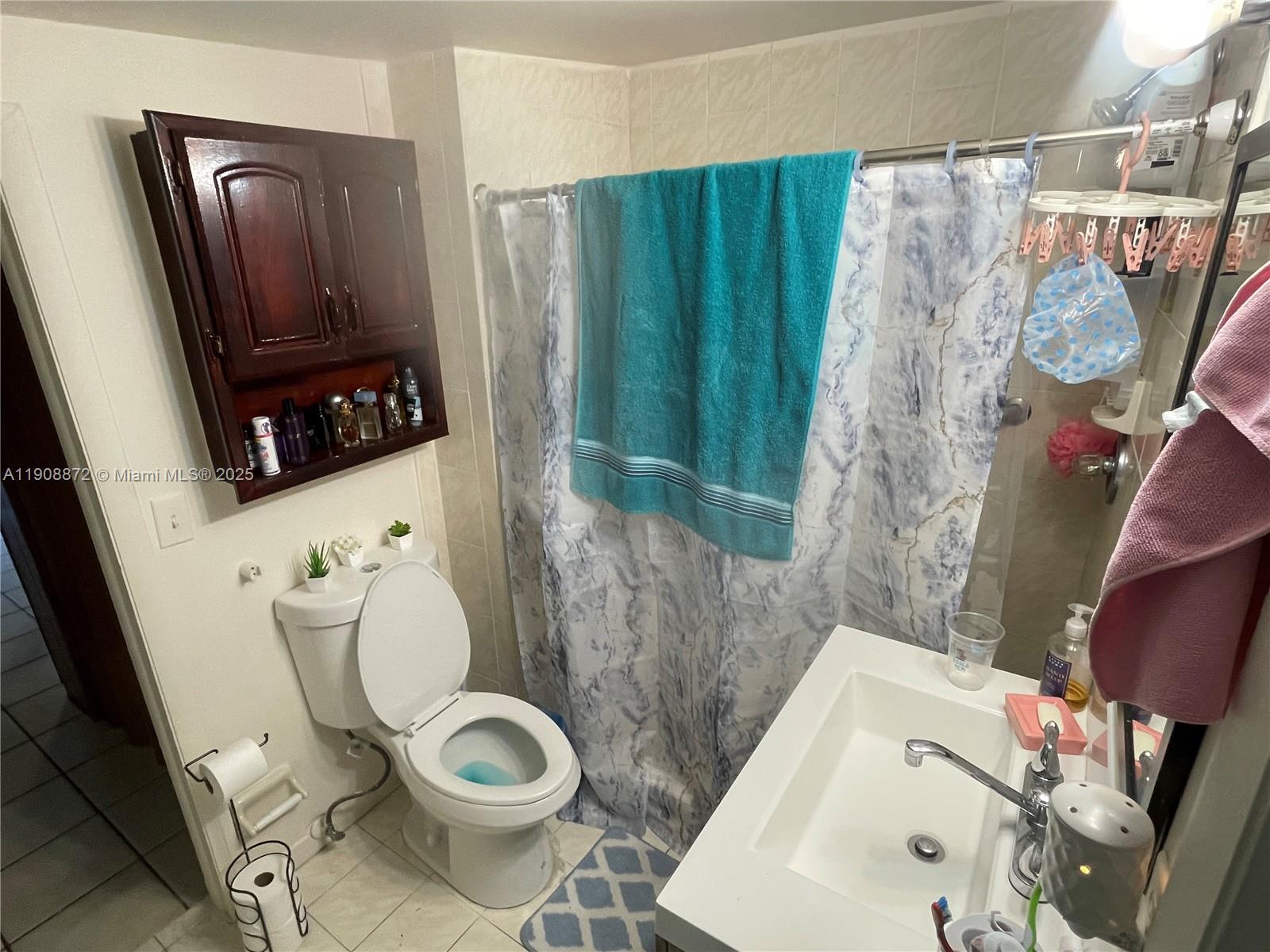 1832 Southwest 3rd Street Miami, FL 33135 - Photo 6 of 25 a bathroom with a toilet and a sink