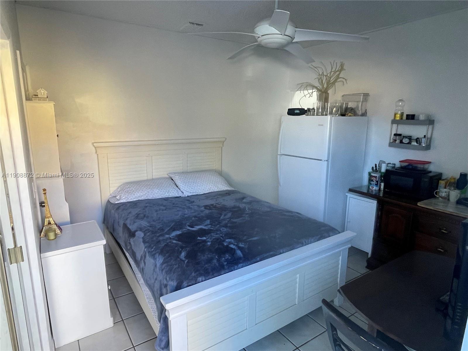 1832 Southwest 3rd Street Miami, FL 33135 - Photo 10 of 25 a bedroom with a bed and a dresser
