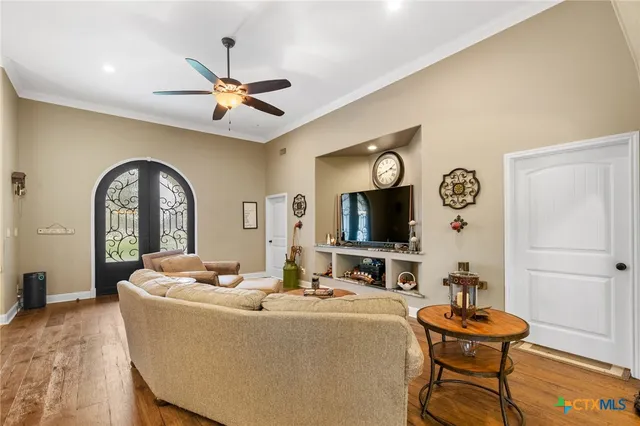 a living room with fireplace furniture and a flat screen tv