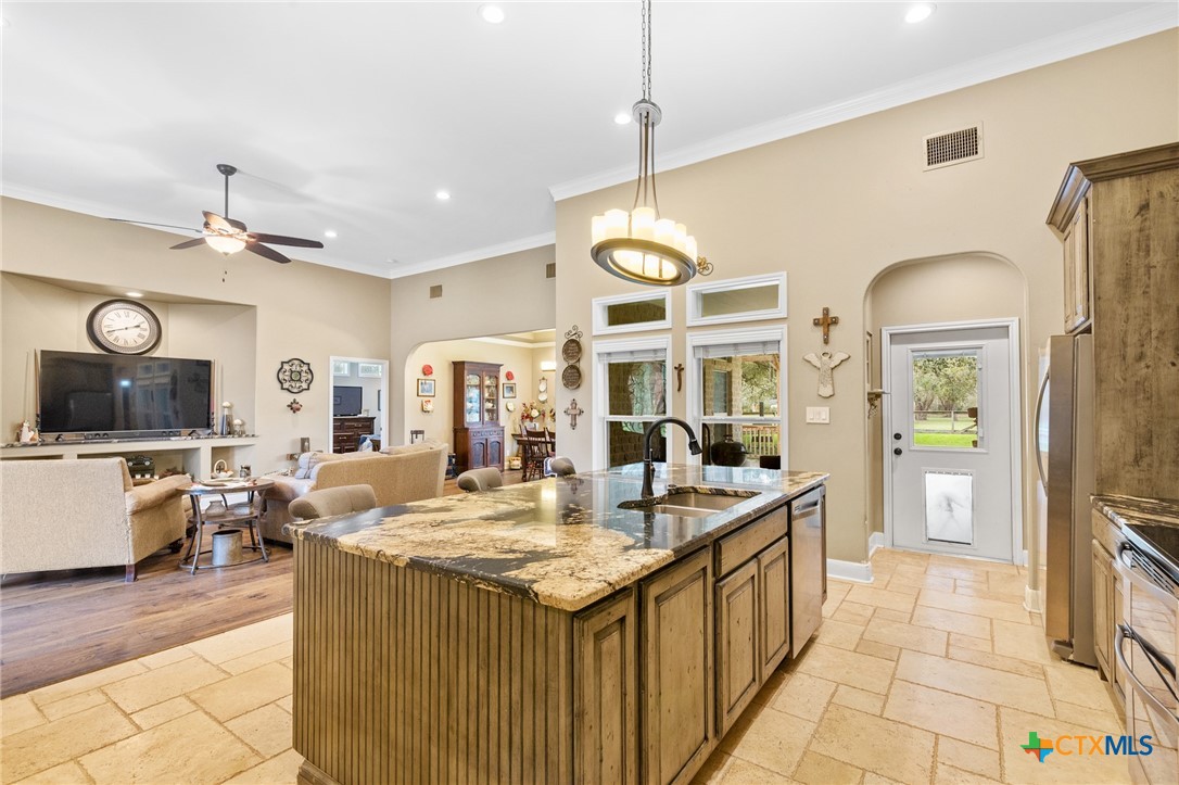 7134 Old Hwy Road Inez, TX 77968 - Photo 12 of 40 a large kitchen with kitchen island a large counter top space appliances and cabinets