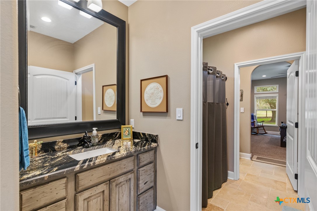 7134 Old Hwy Road Inez, TX 77968 - Photo 21 of 40 a bathroom with a sink and a mirror