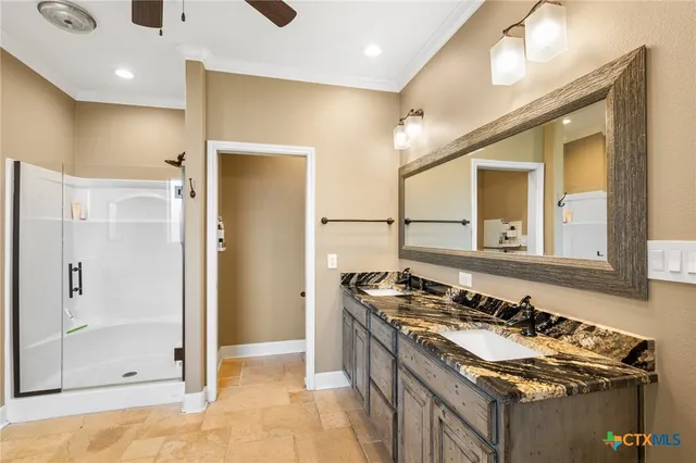 a bathroom with a tub sink and a mirror