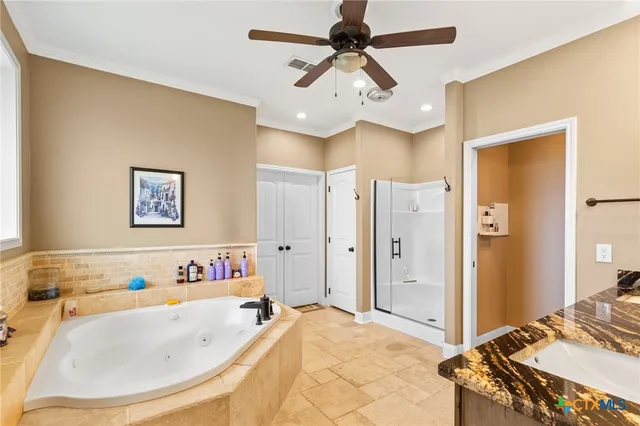 a view of a patio with table and chairs a barbeque with wooden floor and fence