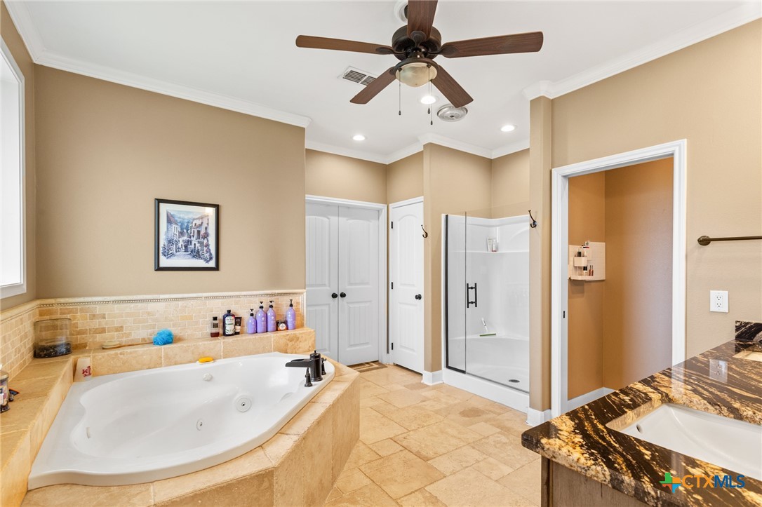 7134 Old Hwy Road Inez, TX 77968 - Photo 27 of 40 a bathroom with a tub sink and a mirror