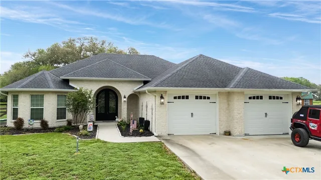a view of a house with backyard porch and furniture
