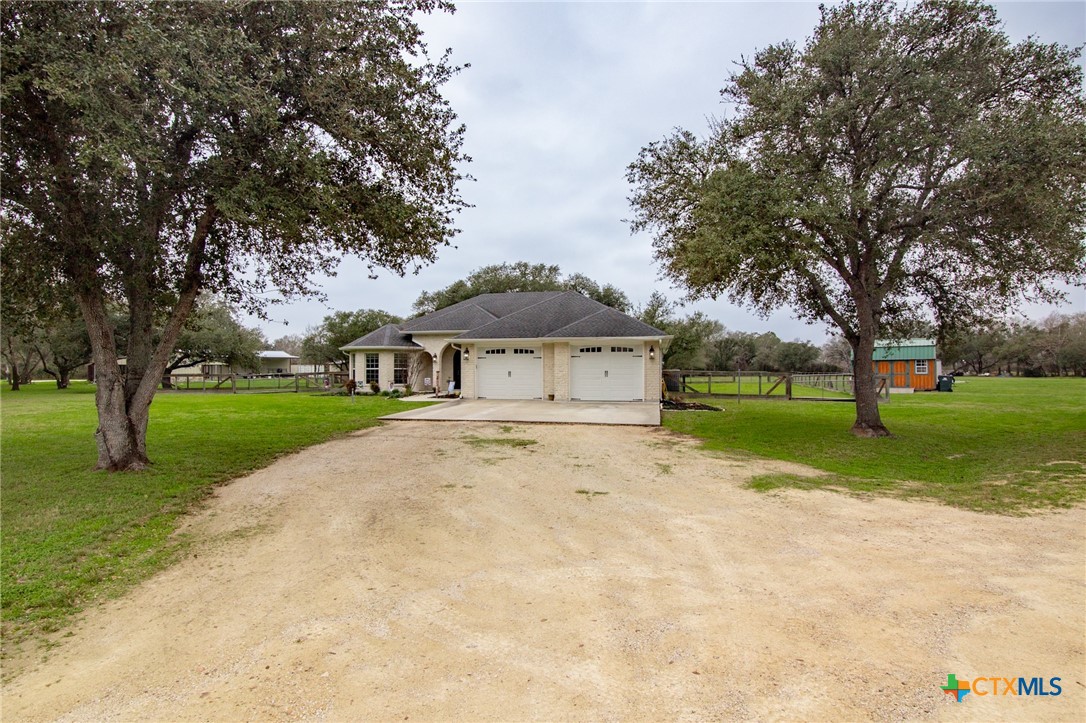 7134 Old Hwy Road Inez, TX 77968 - Photo 7 of 40 a front view of a house with garden