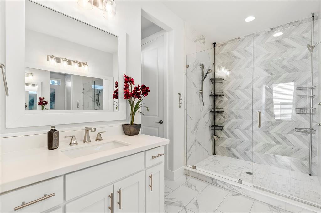 1103 Lavender Ridge Dallas, TX 75204 - Photo 14 of 30 a bathroom with a sink and a mirror