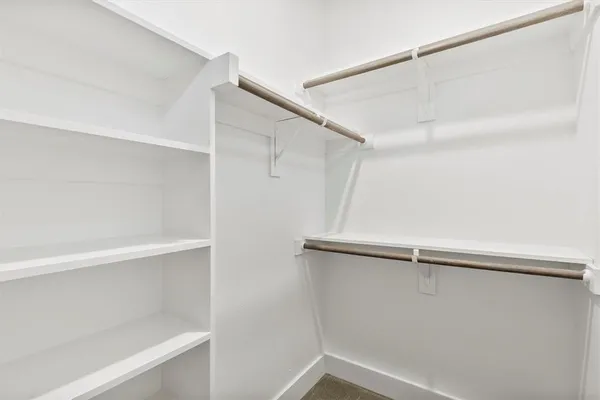 a view of an empty walk in closet
