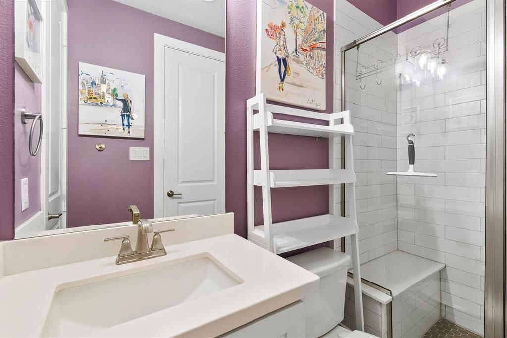 1103 Lavender Ridge Dallas, TX 75204 - Photo 19 of 30 a bathroom with a sink and a mirror