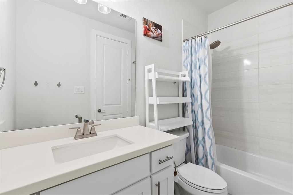 1103 Lavender Ridge Dallas, TX 75204 - Photo 22 of 30 a bathroom with a sink toilet and shower