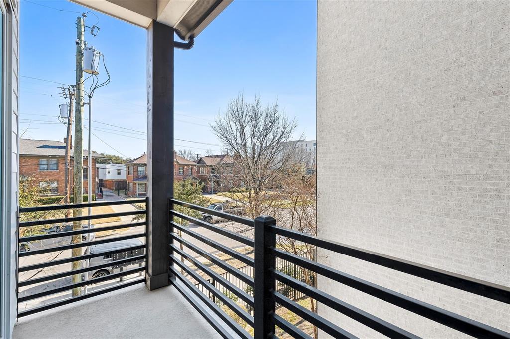 1103 Lavender Ridge Dallas, TX 75204 - Photo 25 of 30 a view of a balcony with floor to ceiling windows with wooden floor