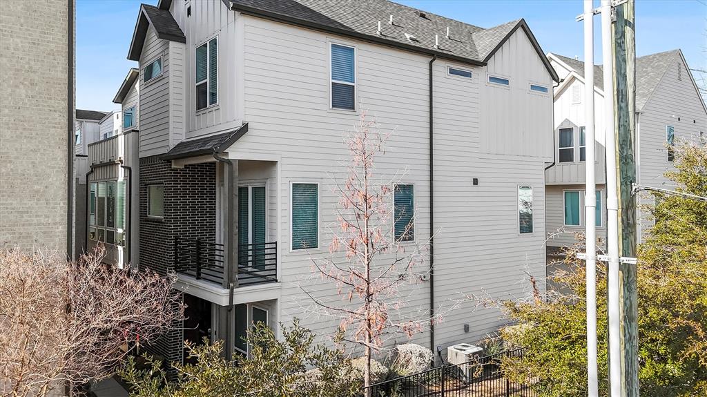1103 Lavender Ridge Dallas, TX 75204 - Photo 27 of 30 a view of a house with brick walls and potted plants