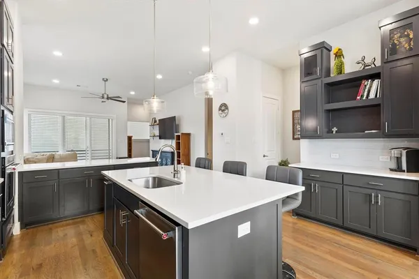 a kitchen that has a sink and a stove in it
