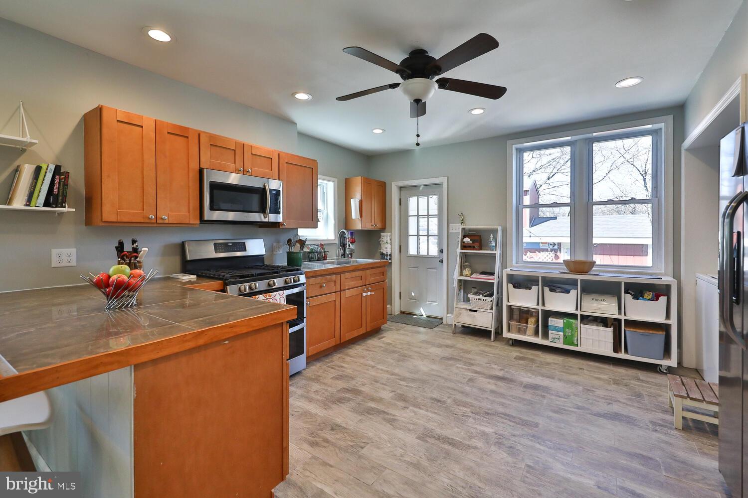 388 Ripka Street Philadelphia, PA 19128 - Photo 14 of 38 a kitchen with stainless steel appliances a stove sink microwave and refrigerator