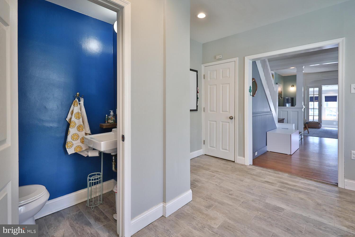 388 Ripka Street Philadelphia, PA 19128 - Photo 18 of 38 a view of a hallway with wooden floor and a bathroom