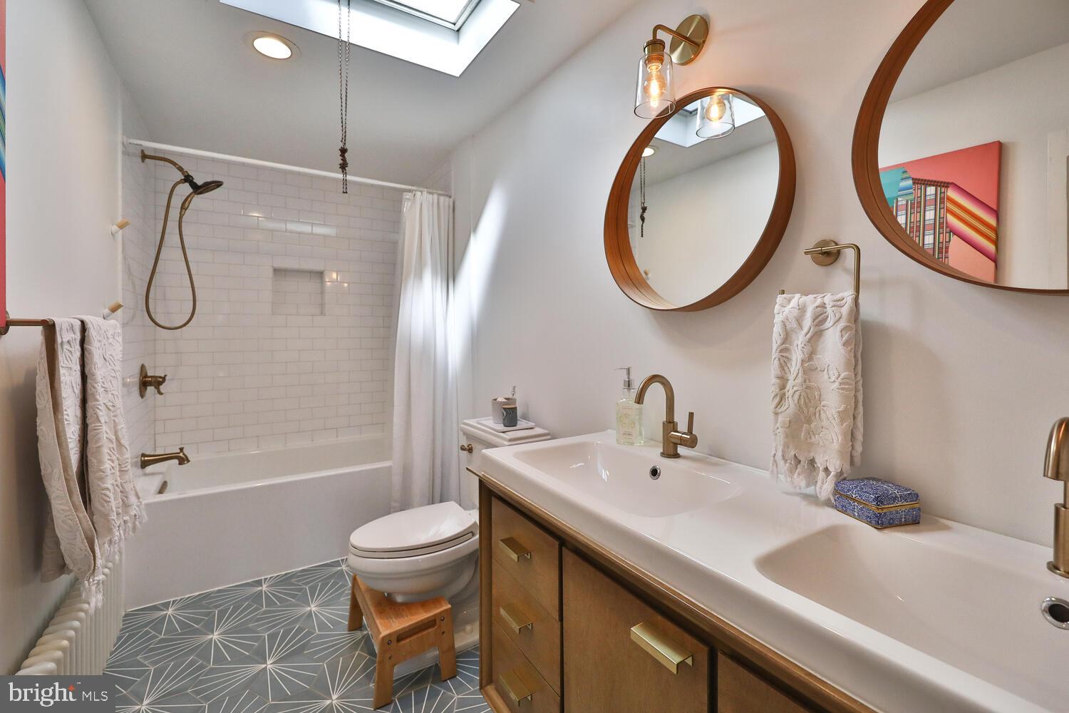388 Ripka Street Philadelphia, PA 19128 - Photo 20 of 38 a bathroom with a sink a toilet and a mirror