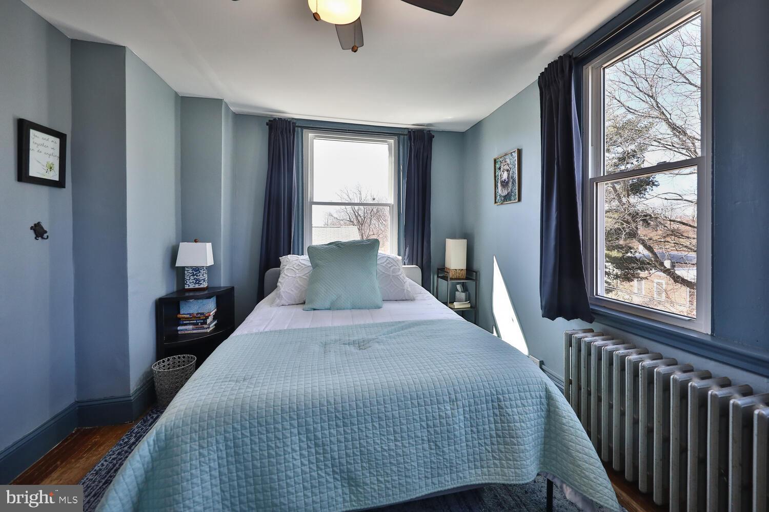 388 Ripka Street Philadelphia, PA 19128 - Photo 22 of 38 a bedroom with a bed and a large window
