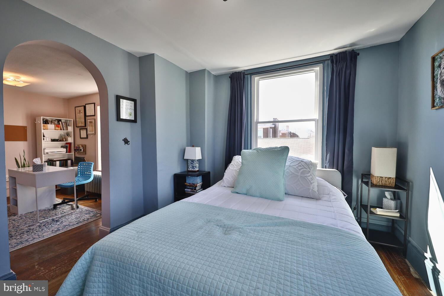 388 Ripka Street Philadelphia, PA 19128 - Photo 23 of 38 a bedroom with a large bed and a large window