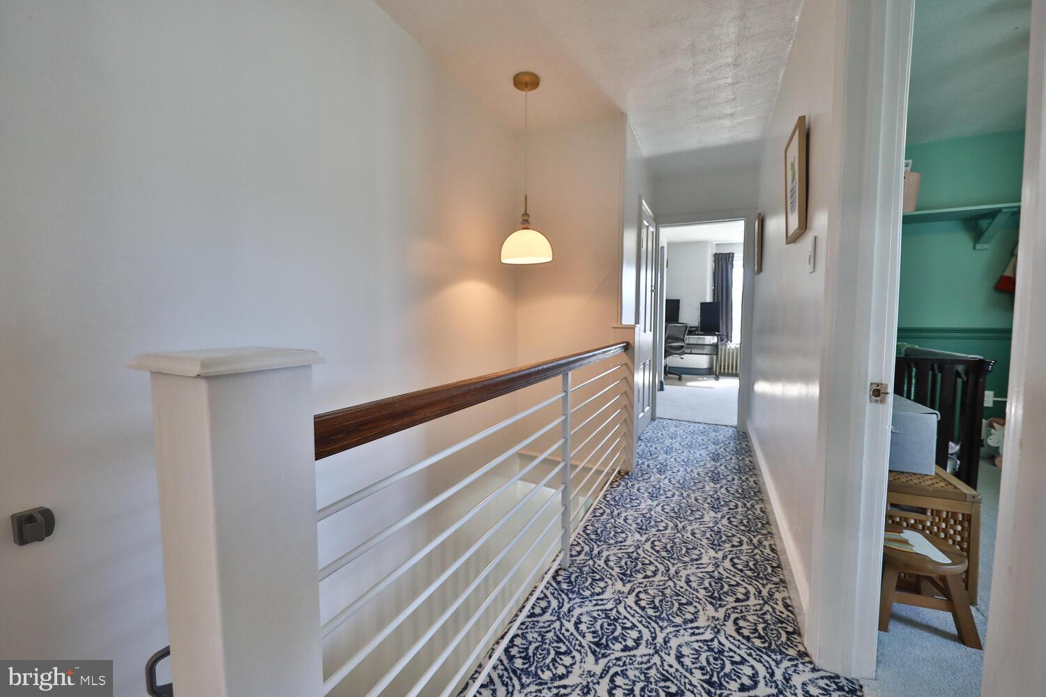 388 Ripka Street Philadelphia, PA 19128 - Photo 25 of 38 a view of a hallway with wooden floor and staircase
