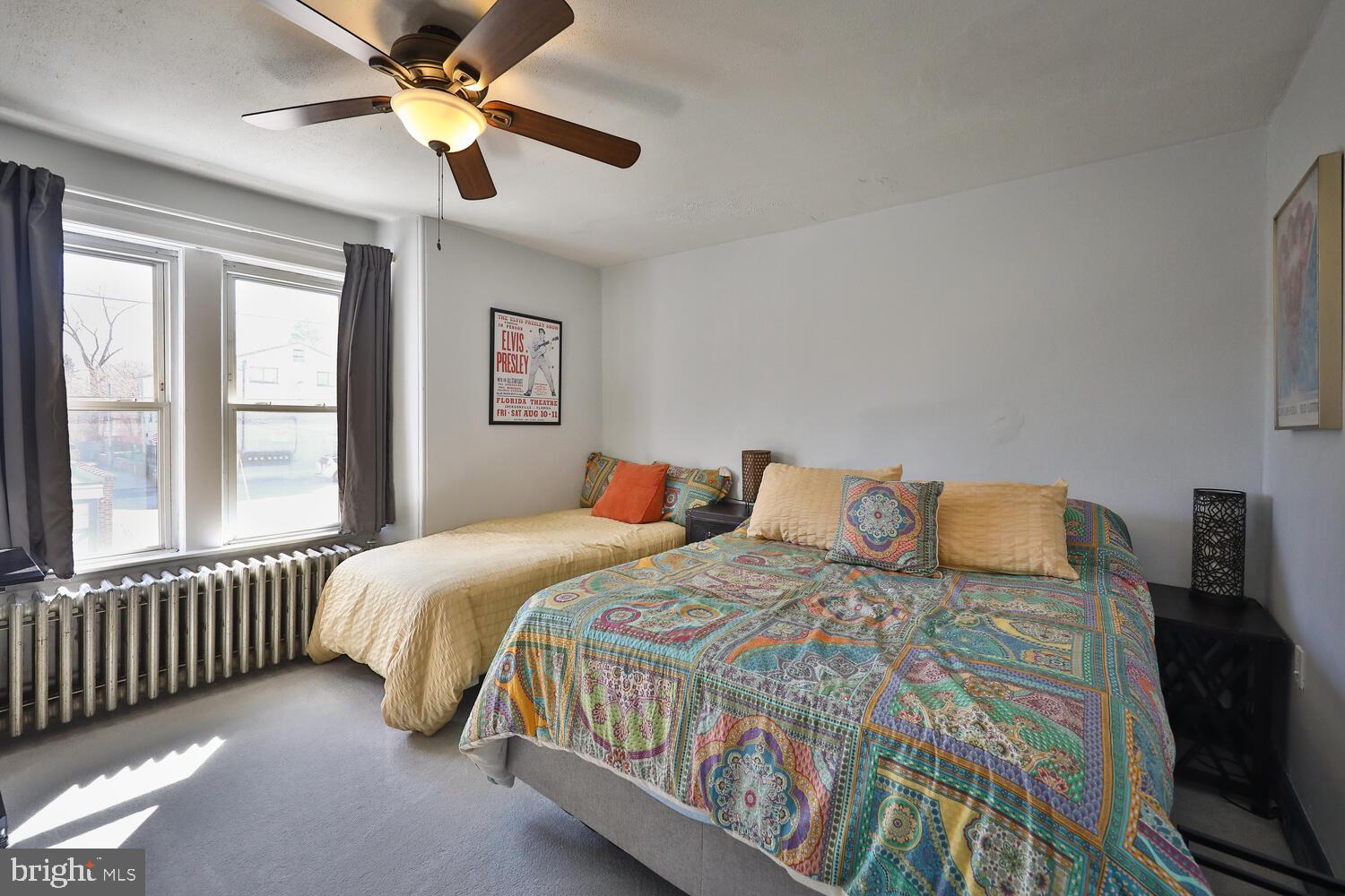 388 Ripka Street Philadelphia, PA 19128 - Photo 28 of 38 a bedroom with a bed next to a window with a bed