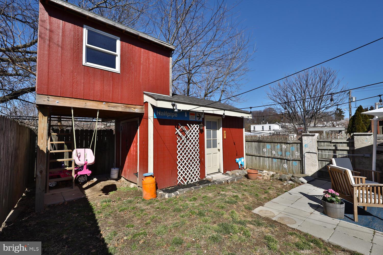 388 Ripka Street Philadelphia, PA 19128 - Photo 34 of 38 a view of a patio with a table and chairs under an umbrella