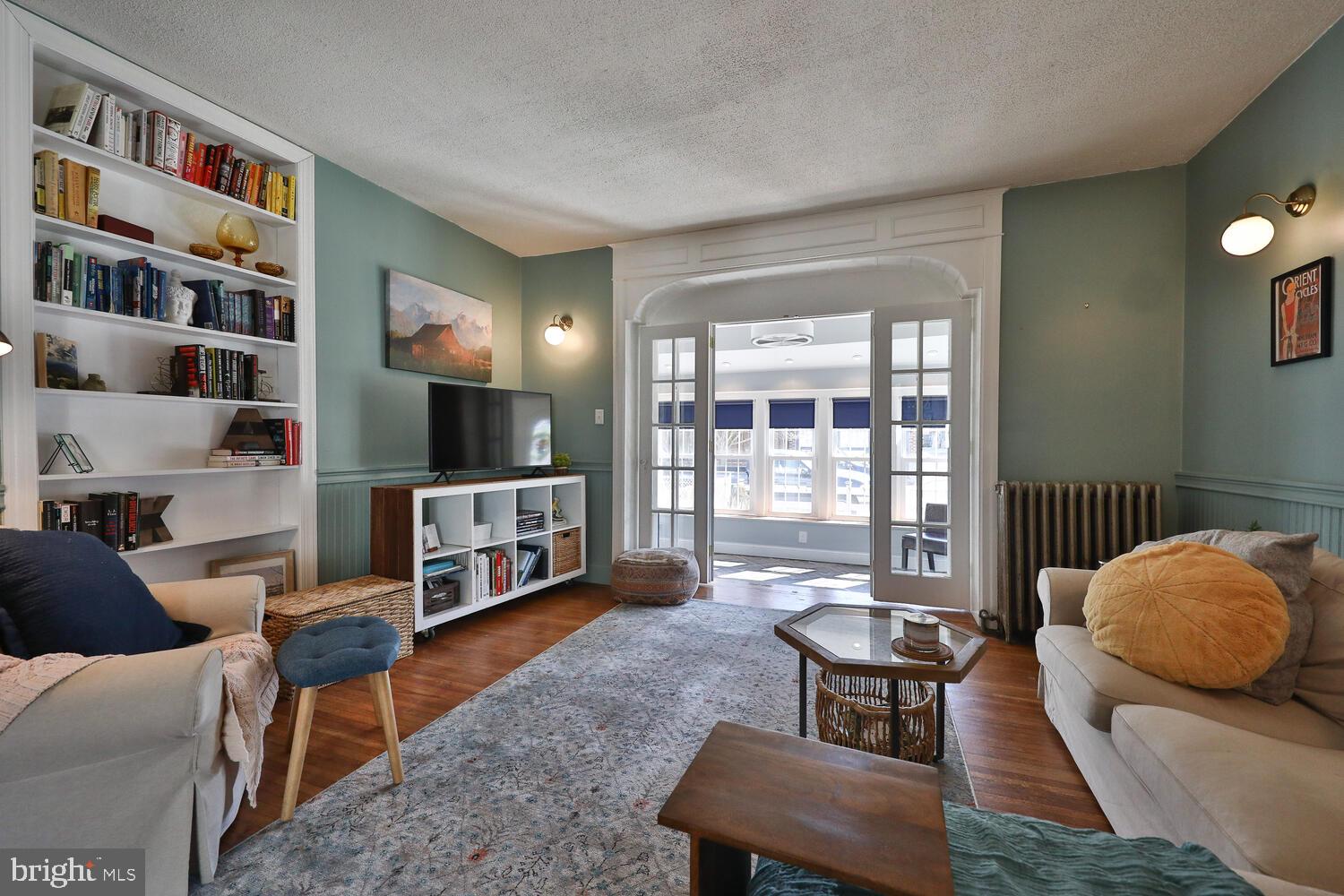 388 Ripka Street Philadelphia, PA 19128 - Photo 6 of 38 a living room with furniture and a book shelf
