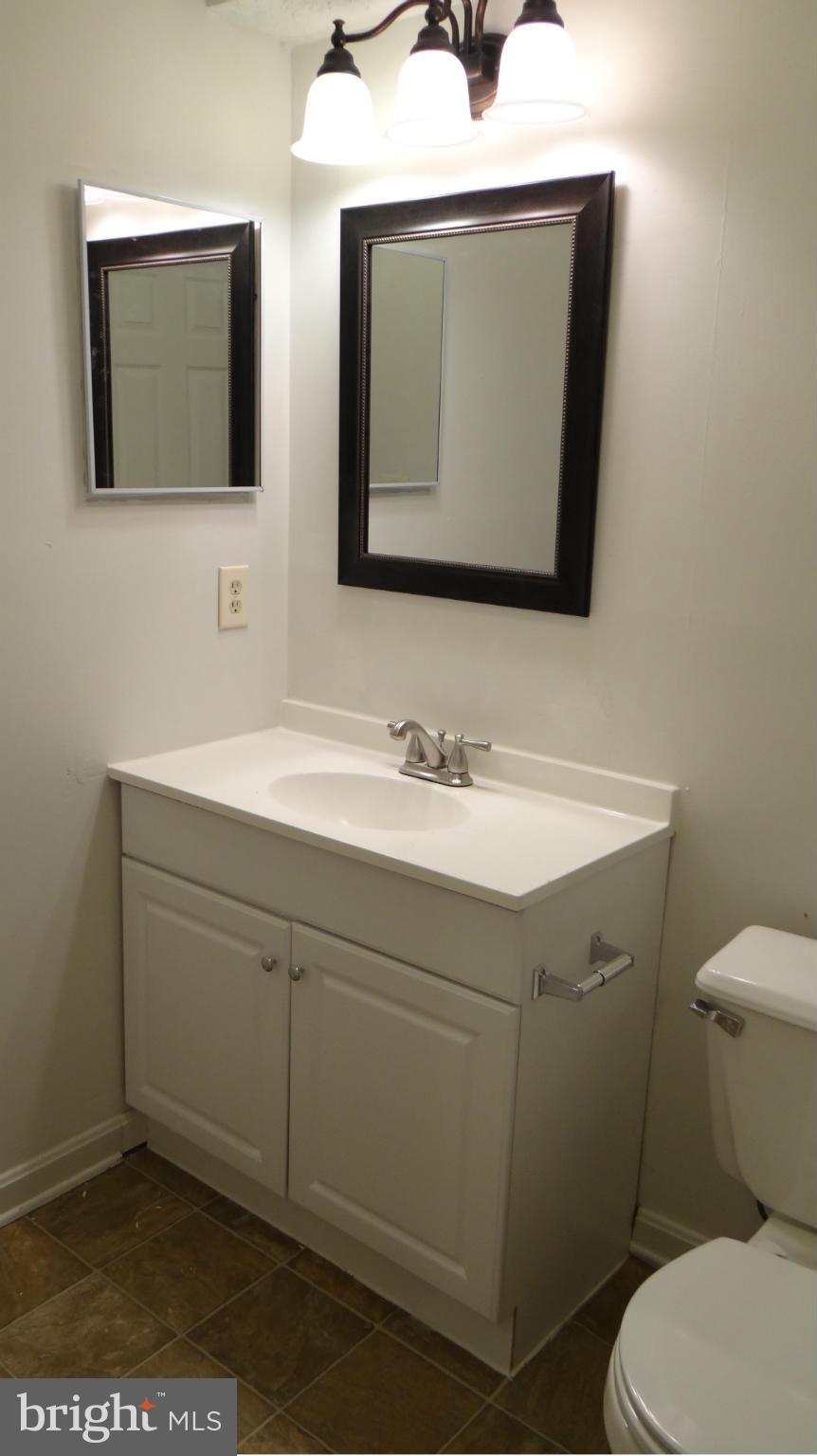 308 Rover Court Stafford, VA 22554 - Photo 12 of 14 a bathroom with a toilet sink and mirror