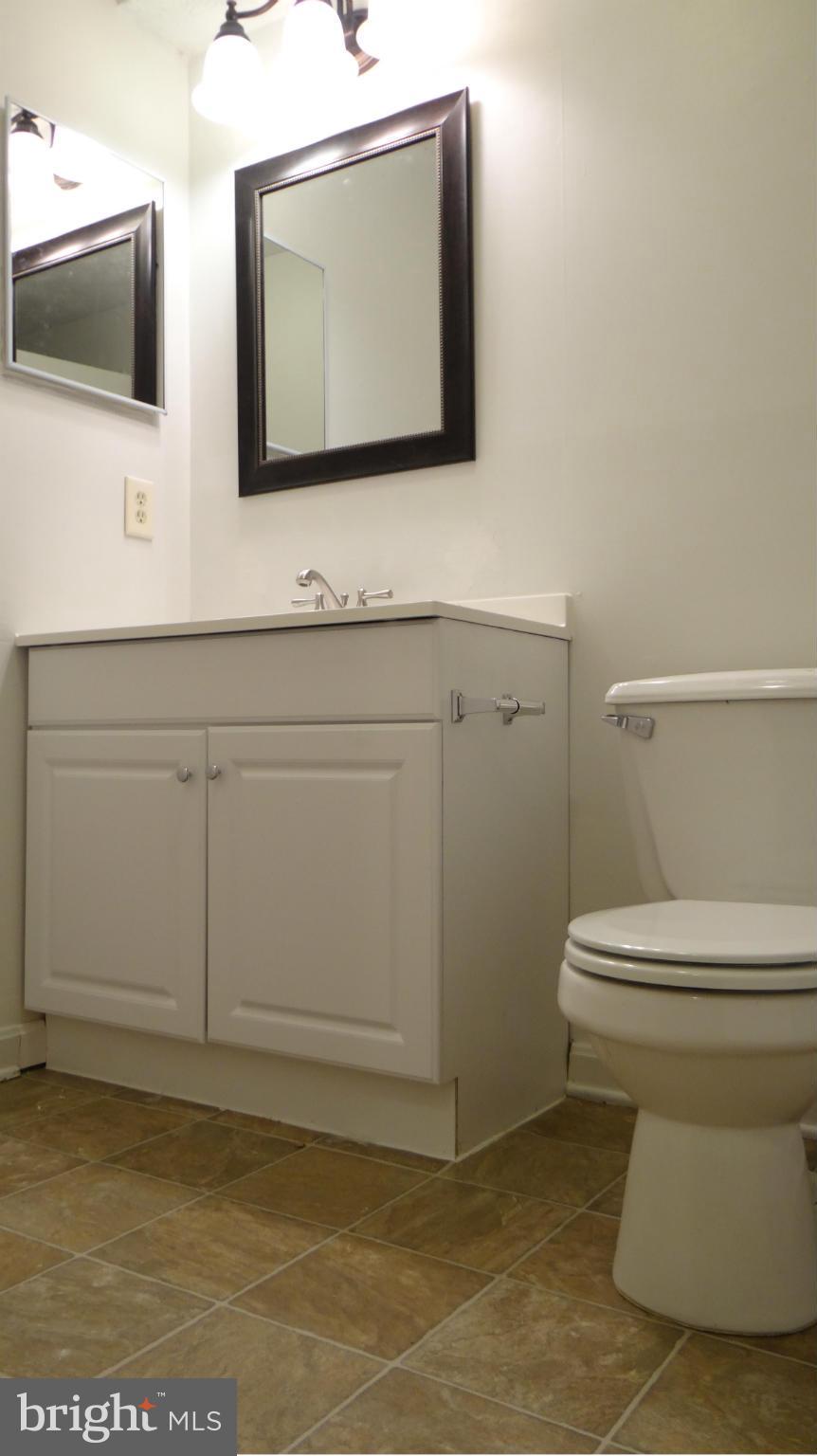308 Rover Court Stafford, VA 22554 - Photo 13 of 14 a bathroom with a toilet sink and mirror