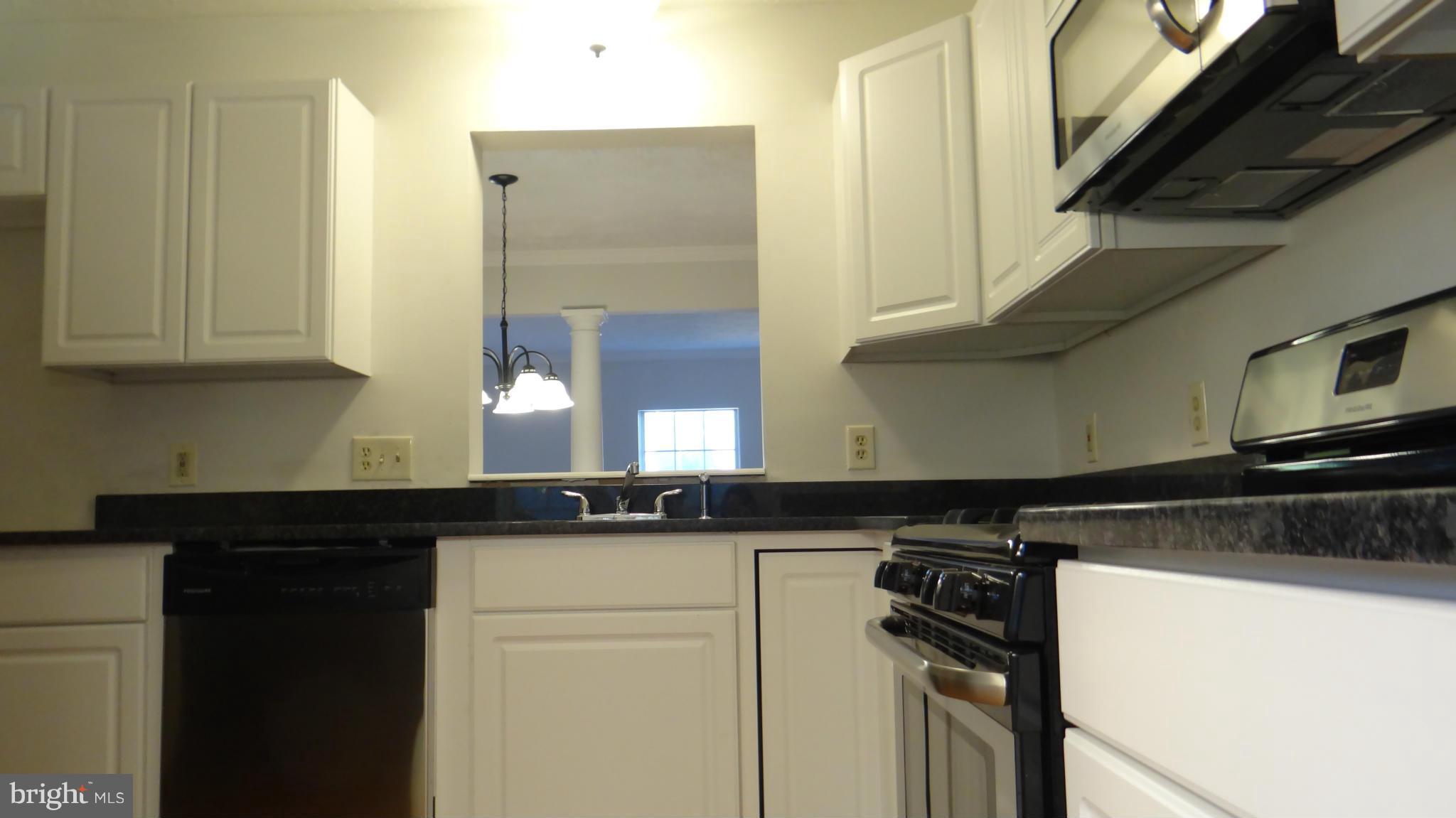 308 Rover Court Stafford, VA 22554 - Photo 4 of 14 a kitchen with a sink and a refrigerator