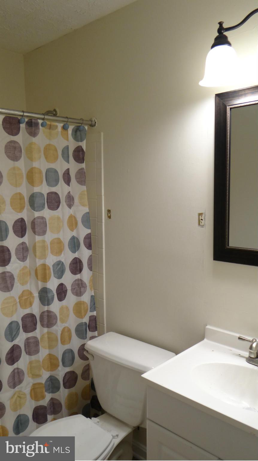 308 Rover Court Stafford, VA 22554 - Photo 10 of 14 a bathroom with a sink and a mirror