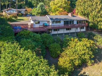 a front view of a house with a garden