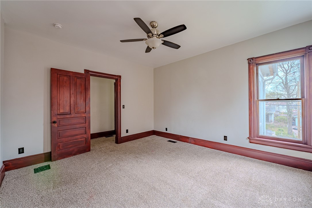 308 Yankee Road Middletown, OH 45044 - Photo 30 of 47 Bright and airy bedroom with neutral carpeting and classic wood trim.