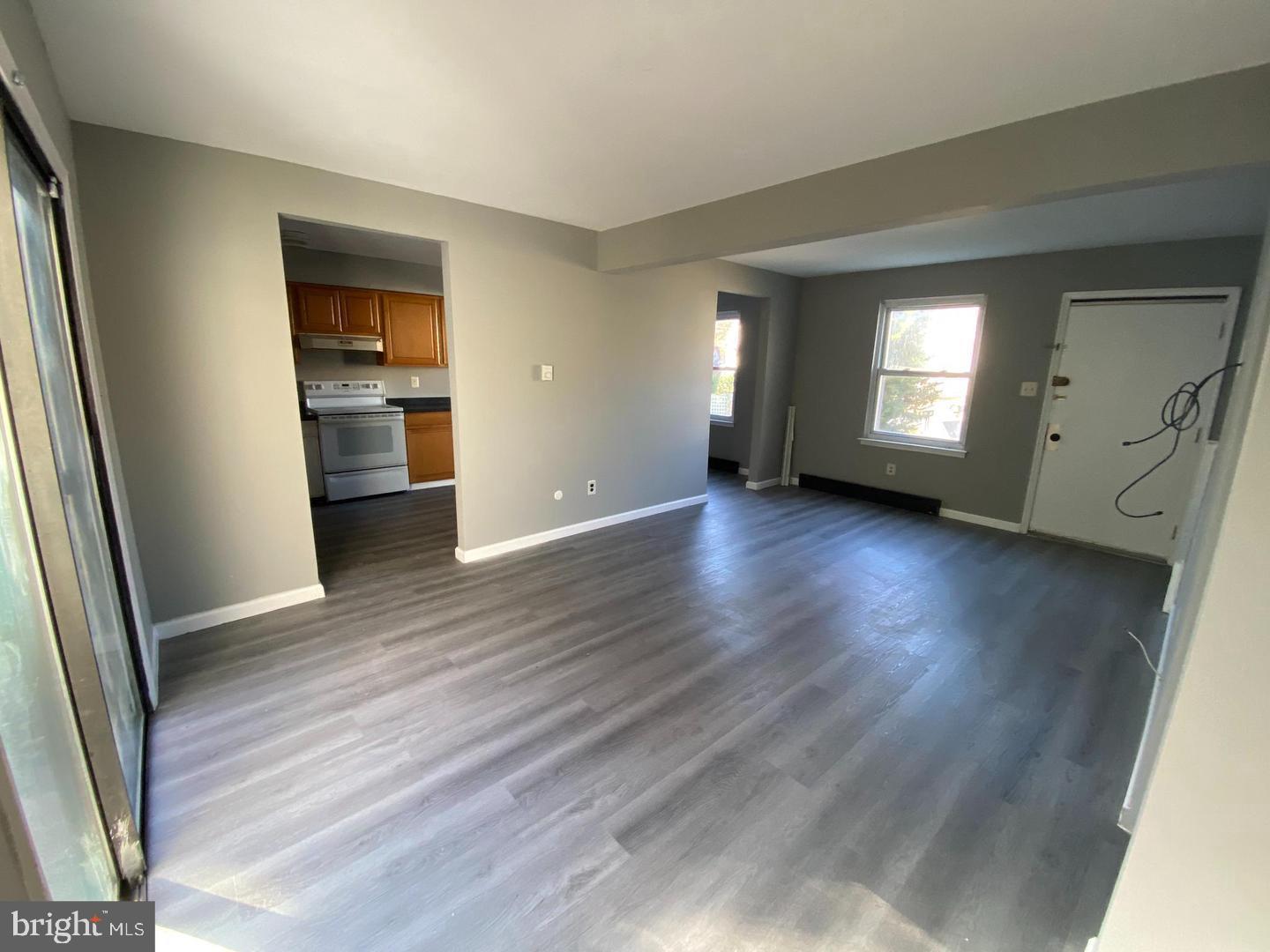 14 Berkshire Road Sicklerville, NJ 08081 - Photo 5 of 15 an empty room with wooden floor and windows